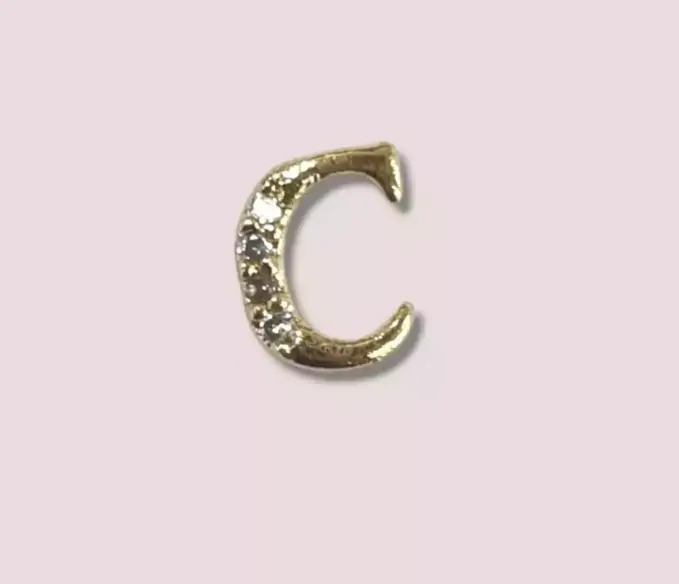 Joyeria para uñas letras surtidas ___ PACK X25