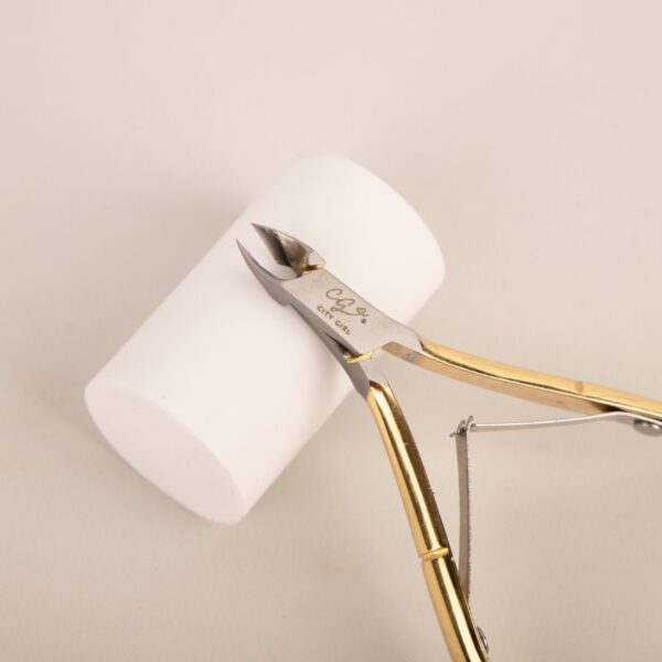 CORTA CUTICULAS DORADO